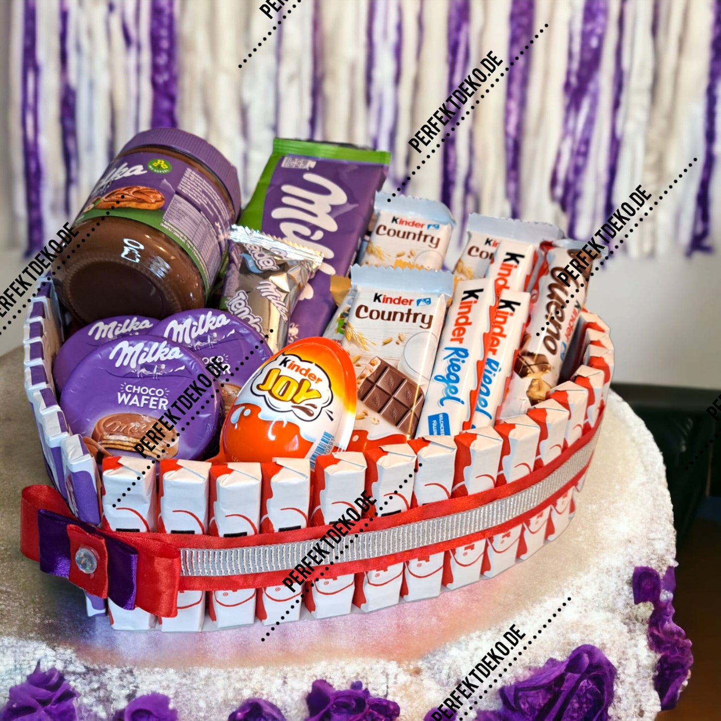 Heart-shaped cake with Milka and Kinder chocolate – perfect gift for chocolate lovers