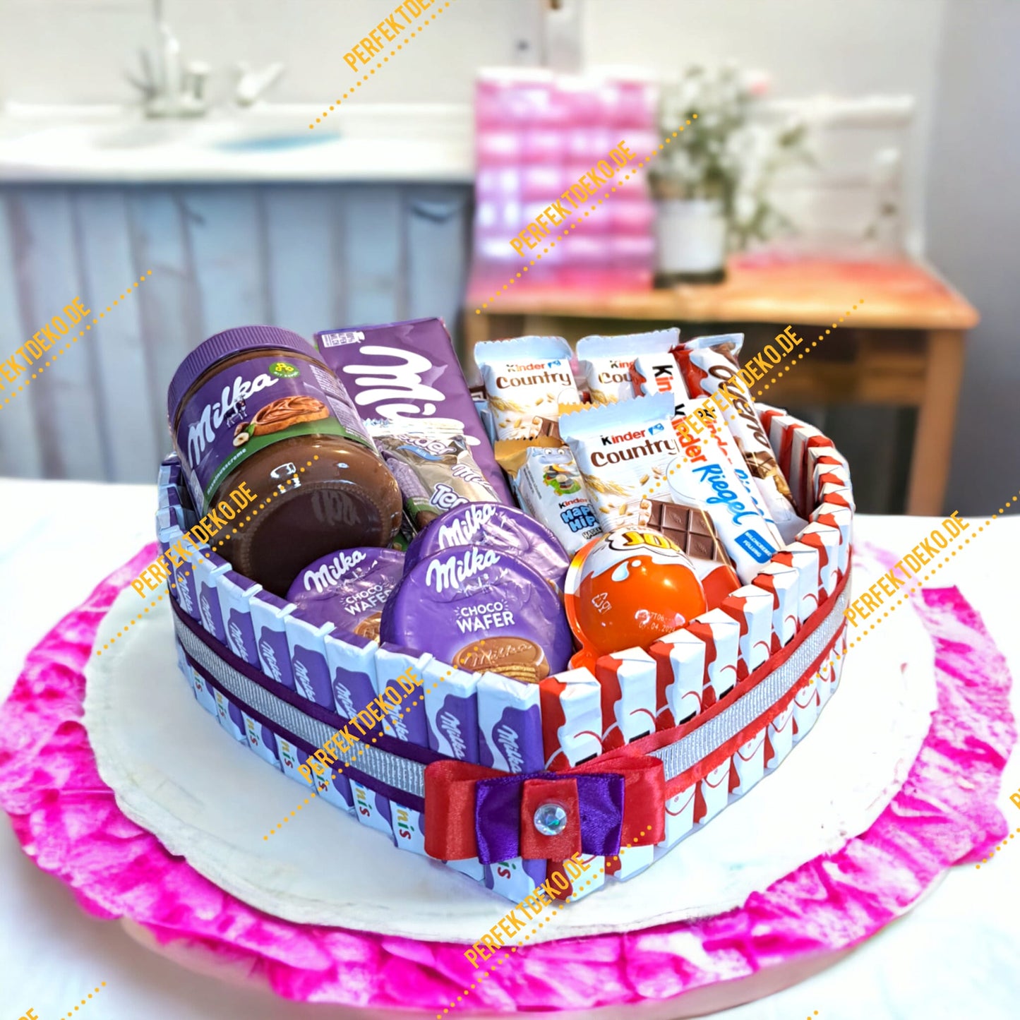Heart-shaped cake with Milka and Kinder chocolate – perfect gift for chocolate lovers