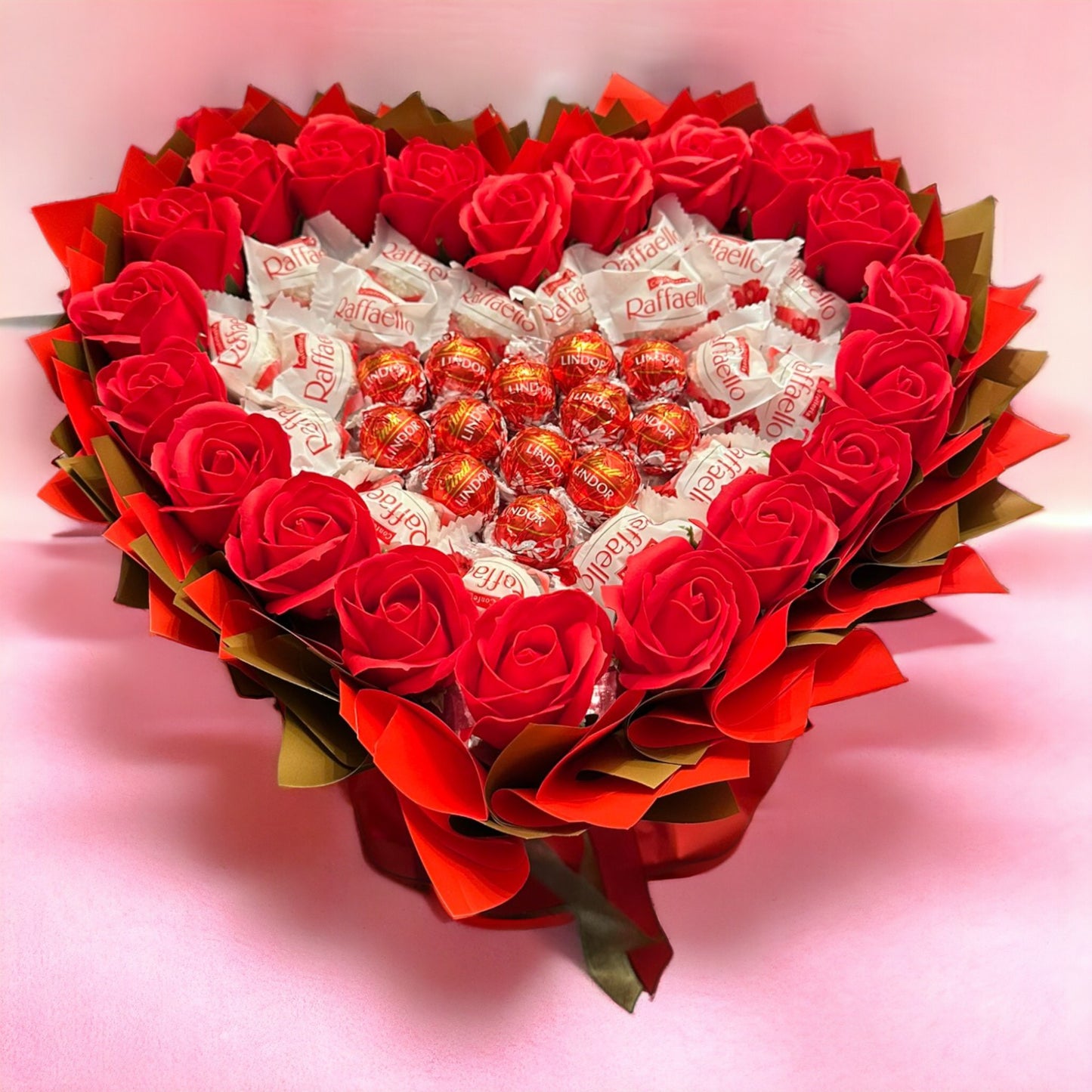 Heart-shaped bouquet with Raffaello, Lindt Lindor & red roses – Romantic gift for special occasions
