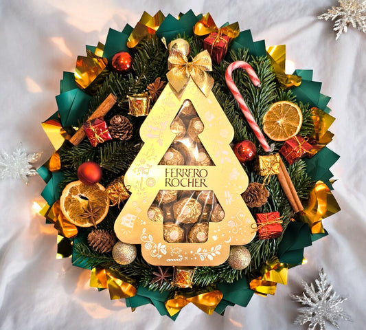 Jul Ferrero Rocher nydelse: Elegant buket med juletræschokolade, kanel og appelsiner – perfekt gave