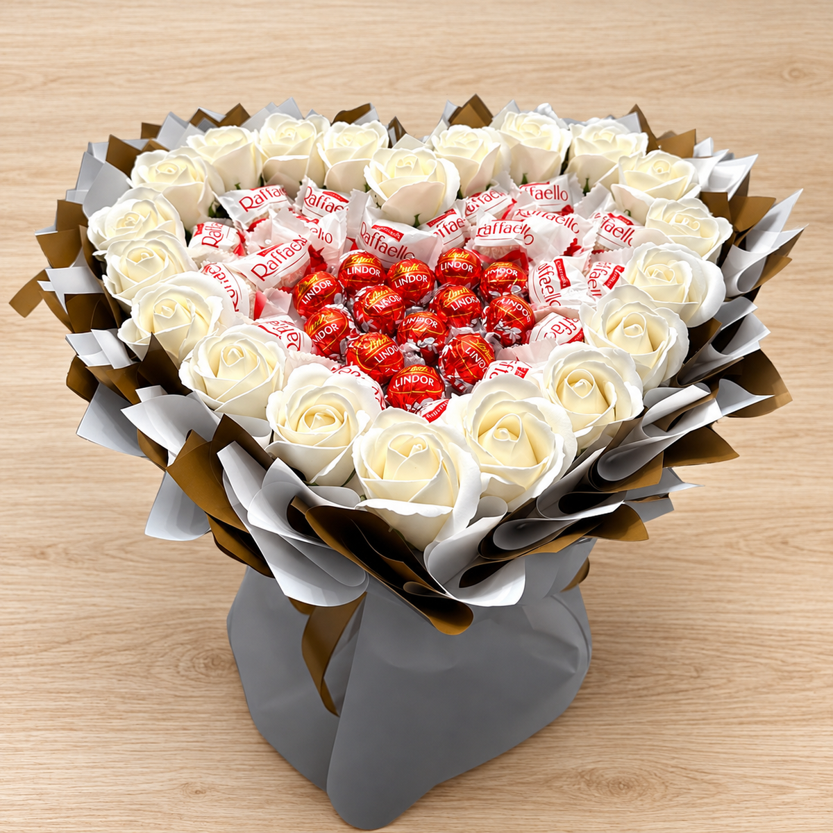 Heart-shaped bouquet with Raffaello, Lindt Lindor &amp; white roses – Elegant gift for romantic occasions 