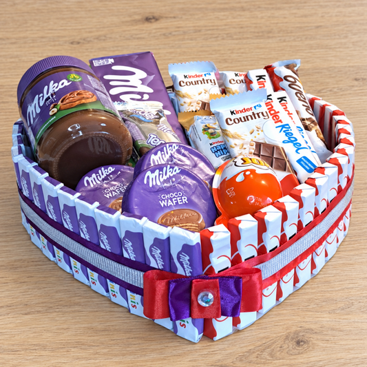 Heart-shaped cake with Milka and Kinder chocolate – perfect gift for chocolate lovers
